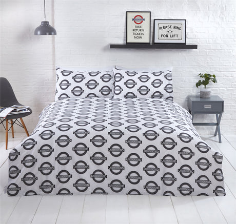 Official TfL licensed product showcasing historic London Underground imagery and stylish popper closure