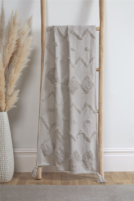 A luxurious and soft Juniper Tufted Throw with a beautiful textured design