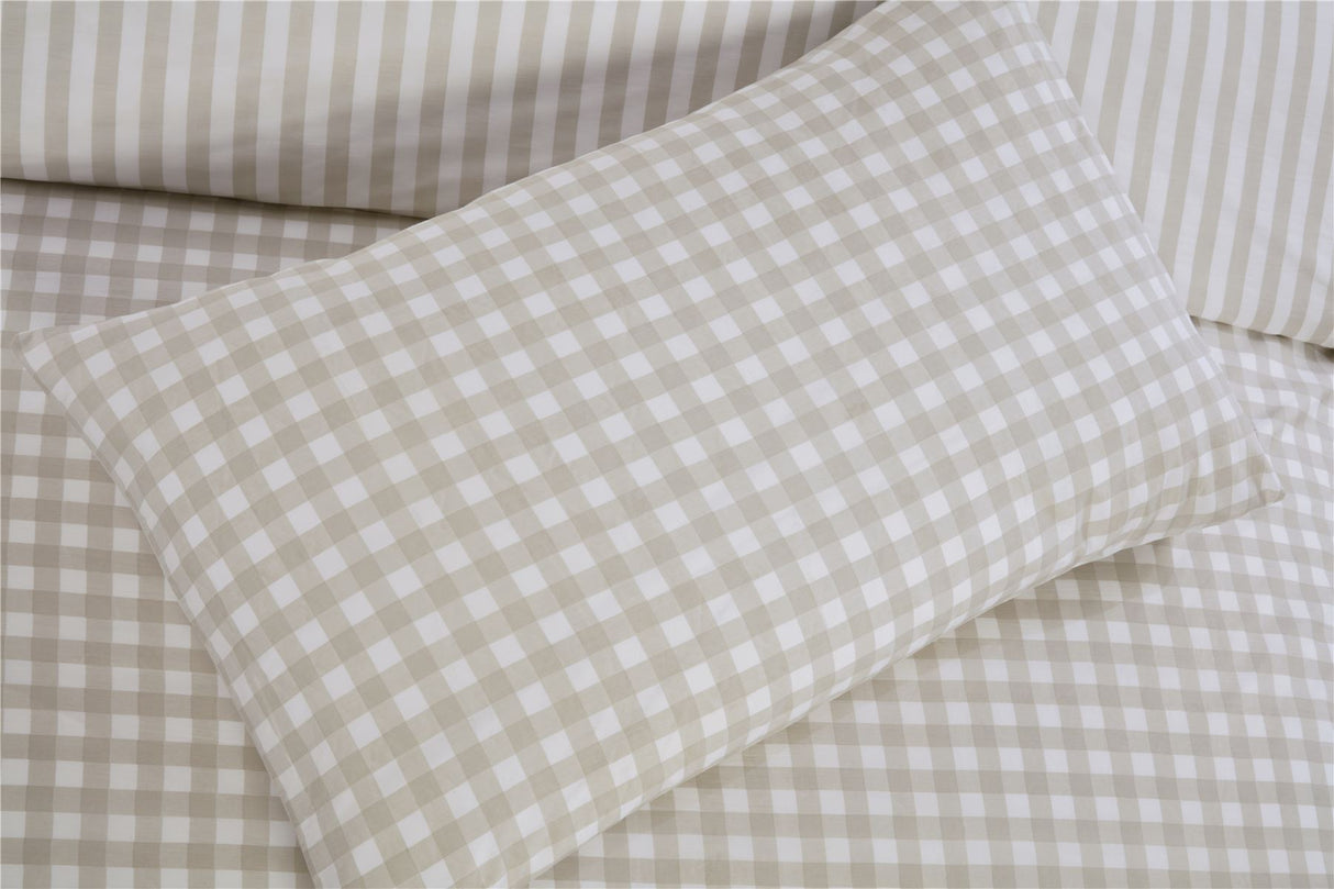 A neatly made bed dressed with the Gingham Check Duvet Set, highlighting its classic style and comfort