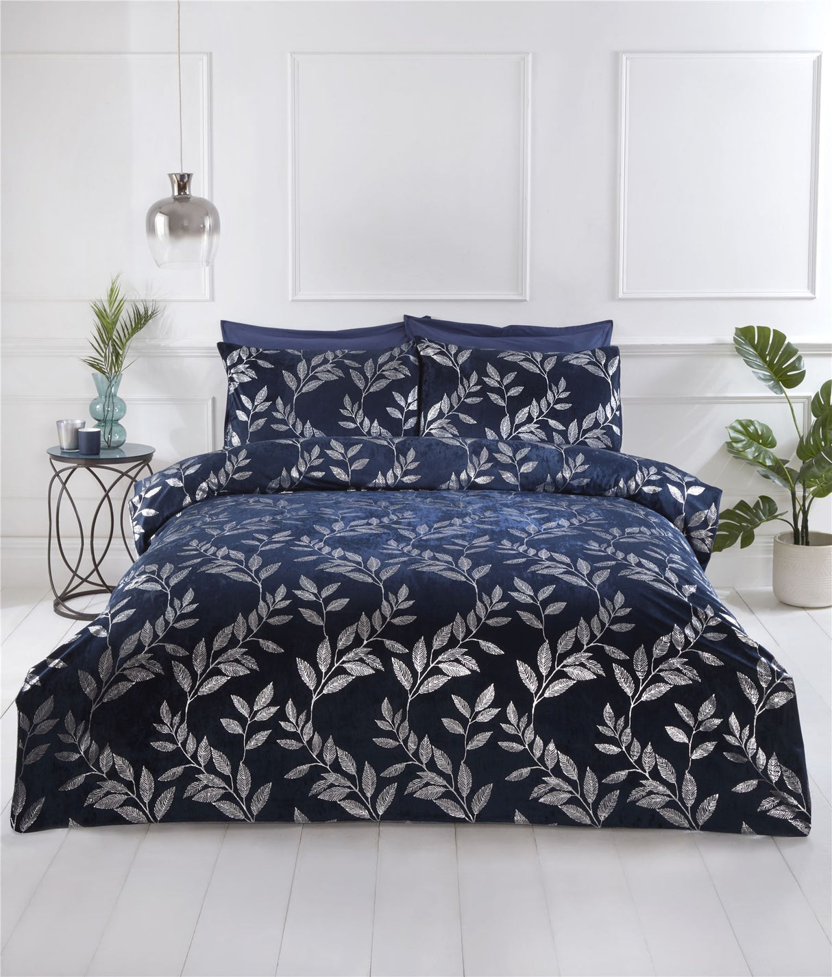 Luxurious navy-blue Como Duvet Set featuring silver foil printed leaf designs with matching pillowcases