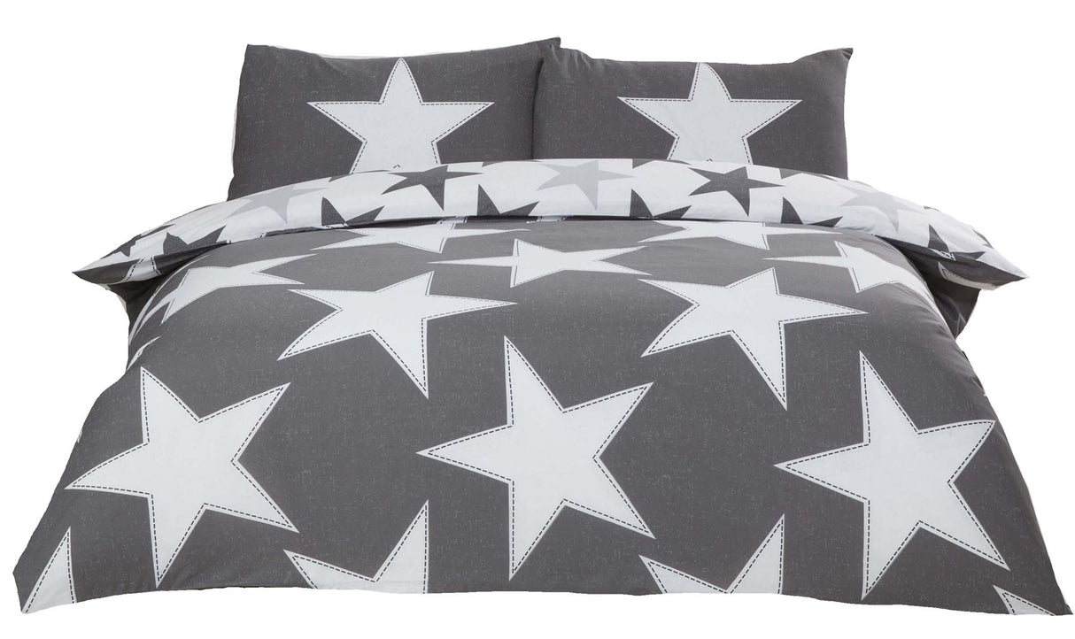 Reversible bedding set with bold star design on one side and smaller stars on the other, including matching pillowcases
