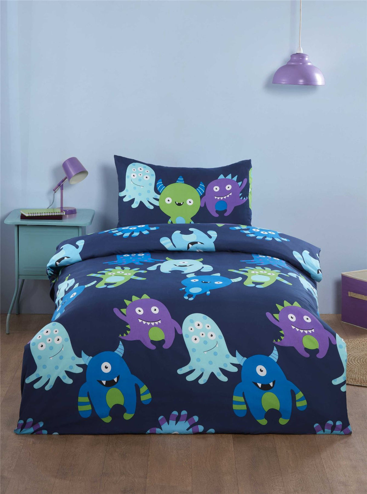A colourful blue and purple monster print duvet set with matching pillowcase, featuring a playful design suitable for kids' bedrooms