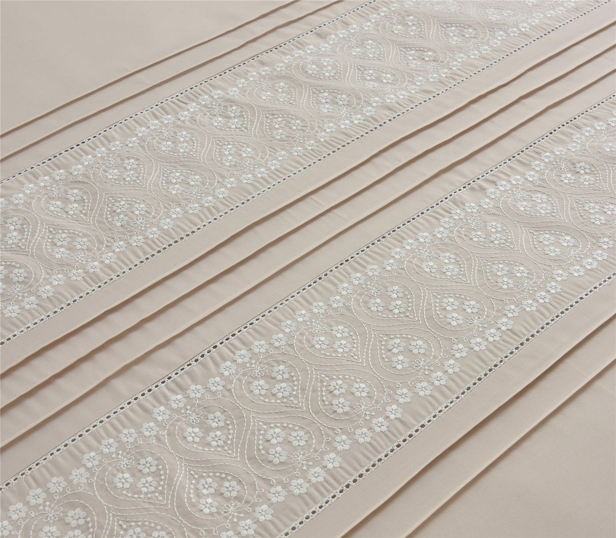 Elegant Charlotte Duvet Set featuring refined floral embroidery and subtle pleated design on neutral bedding