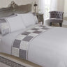 Luxurious mink coloured Batiste Duvet Set featuring a top cuff band, ruched satin panels, damask jacquard squares, and satin ribbon finishing including a kingsize duvet cover and matching pillowcases