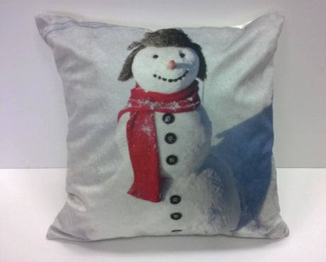 A 43x43cm multi-coloured snowman filled cushion with a frosty photographic snowman design printed on luxuriously soft velvet fabric