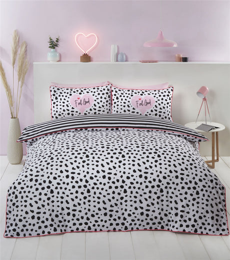 Colorful dalmation print duvet cover with bold pink trim and monochrome tones