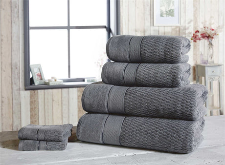 Collection of royal velvet towels with plush cotton weave, perfect for luxurious bathroom use