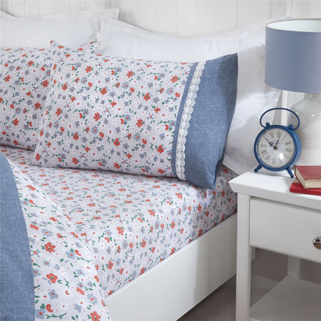Matching pillowcases with pretty springtime flowers and vintage lace details in the Penelope Duvet Set