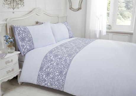 Close-up of the flower and butterfly design on the duvet cover with scalloped trim