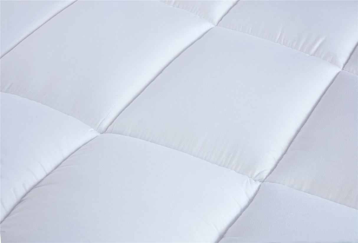 Close-up of a plush, expertly crafted luxury mattress topper with detailed stitching and premium microfibre material
