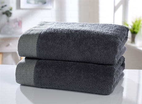 Luxurious tidal towel with herringbone border detailing in 100% cotton fabric