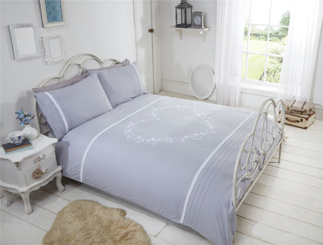 Beautiful heart embroidered bed set with intricate details including birds, butterflies, pocket watches, and keys