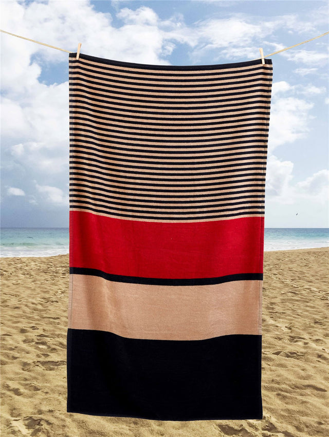 A large Hugo Beach Towel measuring 85x160cm featuring a red, cream, and blue block and stripe design, made from durable blended cotton, ideal for poolside or beach use and suitable for gifting