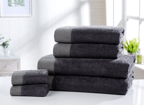 Premium tidal towels in 100% cotton with intricate herringbone design on the border for an elegant bathroom upgrade