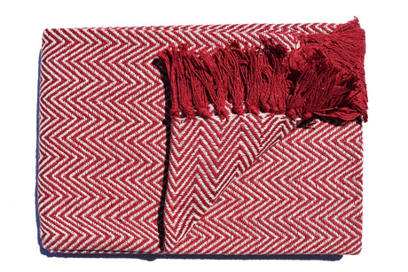 Close-up of the Skye Throw showcasing its textured herringbone pattern and colourful tassels, perfect for adding cosy comfort to chairs, sofas or beds