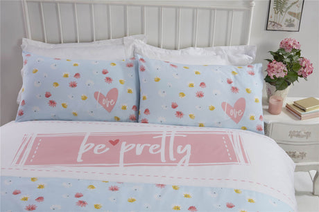 Bright pink floral bedding set with matching pillowcases, featuring easycare fabric and reversible design for versatile styling