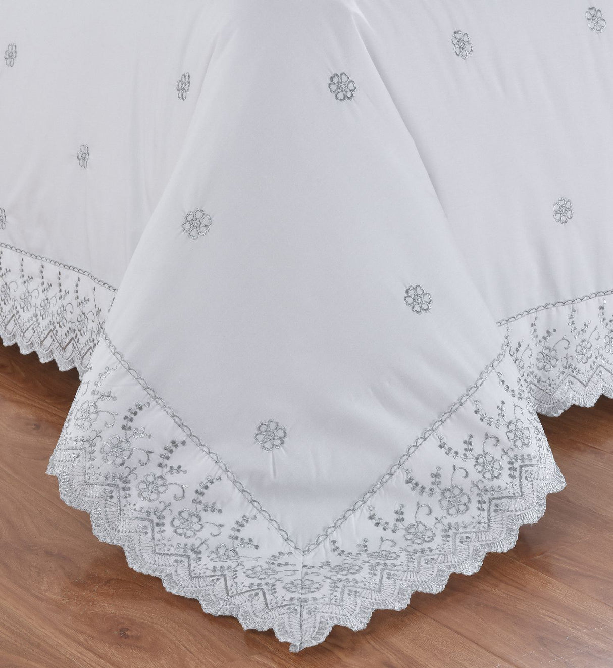 Serene bedroom scene showcasing the elegant Gabrielle Duvet Set with intricate embroidery and classic charm