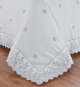 Serene bedroom scene showcasing the elegant Gabrielle Duvet Set with intricate embroidery and classic charm
