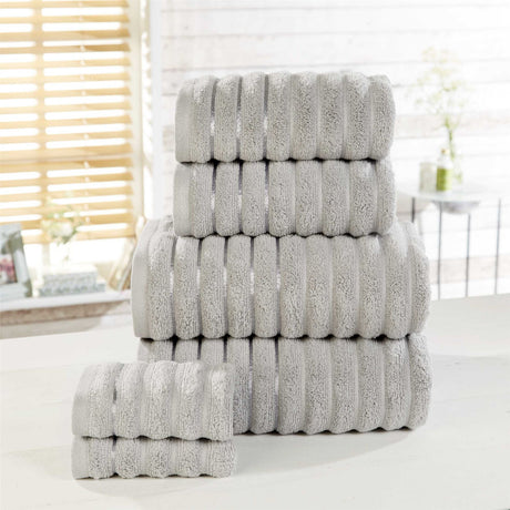 Large 90x140cm bath sheet with plush ribbed surface, stripe details, and silky sheen borders for a refined finish