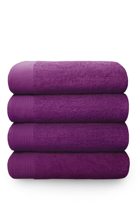 Close-up of the Happy Home magenta bath mat showcasing its plush, absorbent 600GSM cotton and durable, lofty pile for long-lasting comfort