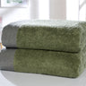 Collection including face cloths, hand towels, bath towels, and bath sheet, all with herringbone detail and plush cotton texture