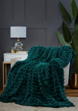 Cozy bedroom setup with the rabbit fur throw neatly folded for added warmth and style