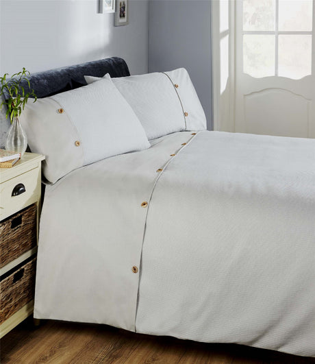 Luxurious waffle-patterned duvet set with horizontal border and button details