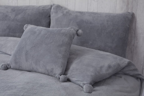 Soft and cozy Pom Pom Fleece Filled Cushion measuring 43X43cm