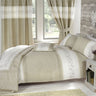 Close-up of Wildberry duvet set displaying detailed embroidered floral design and linen trim with matching pillowcases