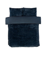 An inviting bed dressed with the rabbit faux-fur duvet set, ideal for creating a restful sanctuary