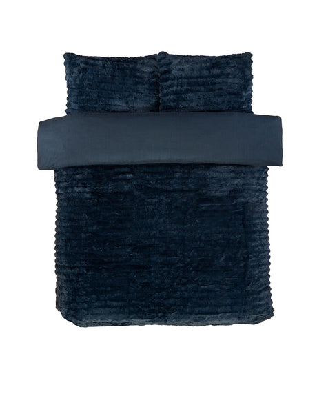 An inviting bed dressed with the rabbit faux-fur duvet set, ideal for creating a restful sanctuary