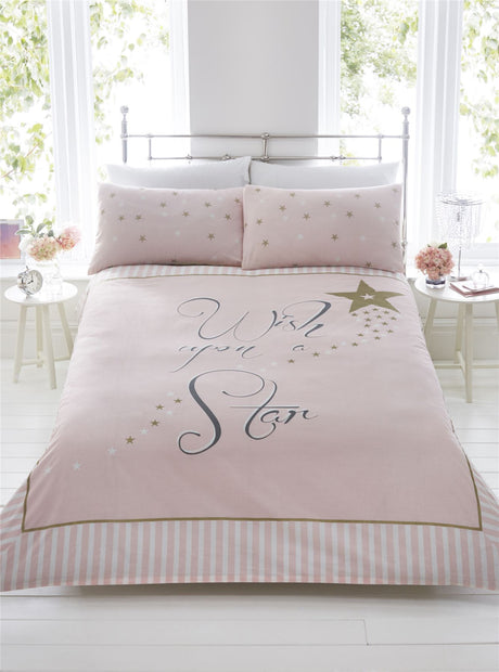 Blush pink duvet set with scrolly writing and gold stars, featuring stripe print border and star speckled pillowcases in single, double, or kingsize Made from easycare fabric with panel printed pillowcases and popper closing mechanism