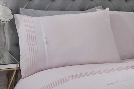 Modern Clarissa duvet set decorated with pintuck patterns and charming ribbon bows for a stylish look