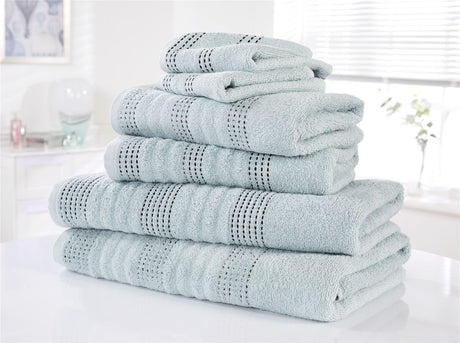 A single face cloth draped over a towel rack demonstrating softness and quality