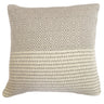 Geometric patterned cushion in muted colours for sofa or bed