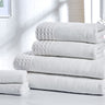 Luxury bath towels with hotel-style waffle trim, crafted from 100% pure cotton for a revitalising experience