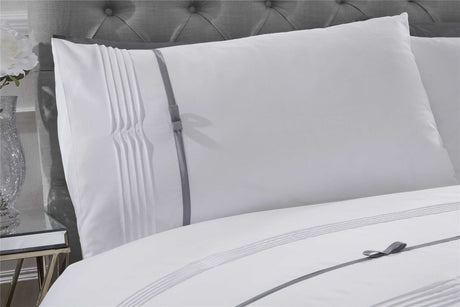 Elegant Clarissa duvet set with finely crafted pintuck detailing and contrasting ribbon bows