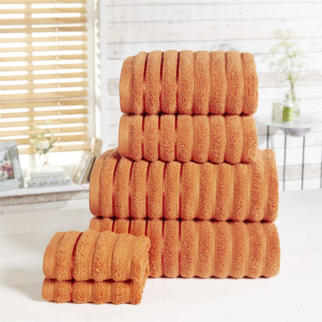 Set includes two bath sheets, two face cloths, two hand towels, and two bath towels, all with matching ribbed texture
