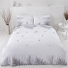 Scattered small tropical leaves on the reverse side of the eco-friendly duvet set, perfect for a fresh bedroom look