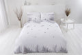 Scattered small tropical leaves on the reverse side of the eco-friendly duvet set, perfect for a fresh bedroom look