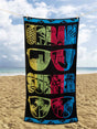 A long, absorbent beach towel with a stylish sunglasses design