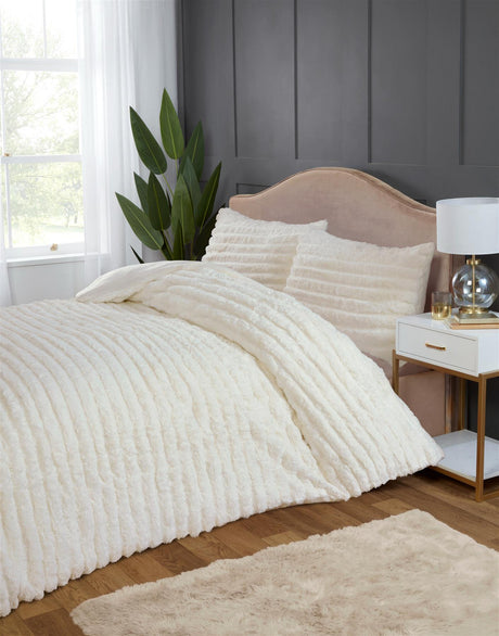 The luxurious faux-fur duvet set in a cosy bedroom setting, perfect for indulgent comfort on chilly nights