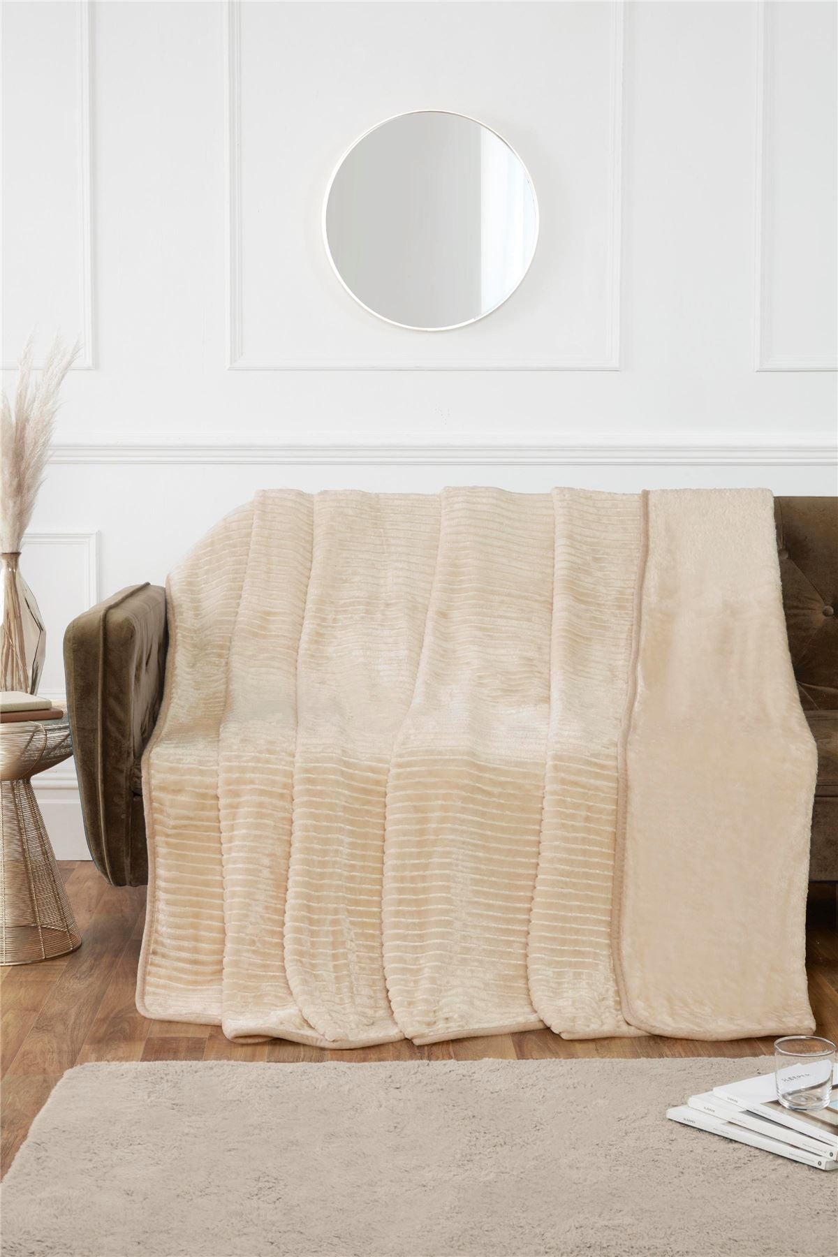 Elegant bedroom setting with the ribbed mink throw placed at the foot of the bed for added style