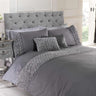 Close-up of the Limoge Duvet Set showing detailed ruffle trim on duvet cover and pillowcases