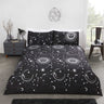 Celestial duvet set featuring metallic suns and moons on a dark background with reversible star design