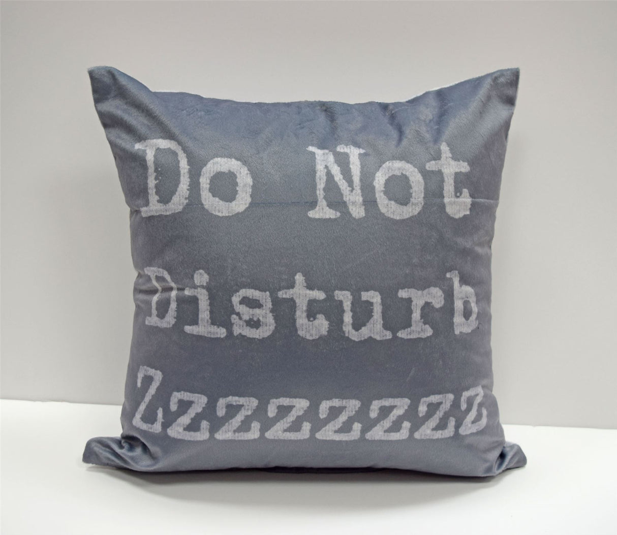 Multi-coloured 43x43cm cushion with Lazy Sunday slogan on reverse side