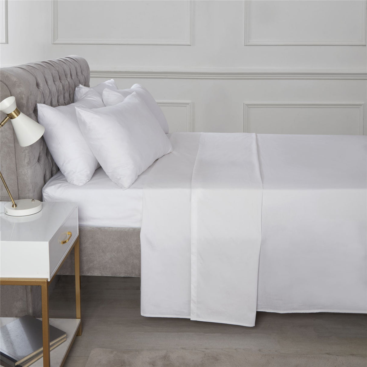 Close-up of a fitted sheet showcasing its smooth, crisp texture and easy-care finish in the Happy Home Essentials range