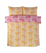 Soft and comfortable Tropical Trails Duvet Set showcasing exotic palm leaf patterns in vivid yellow and pink on a crisp white backdrop
