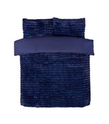 The duvet set placed on a modern bed frame, demonstrating its rich colour and luxurious feel
