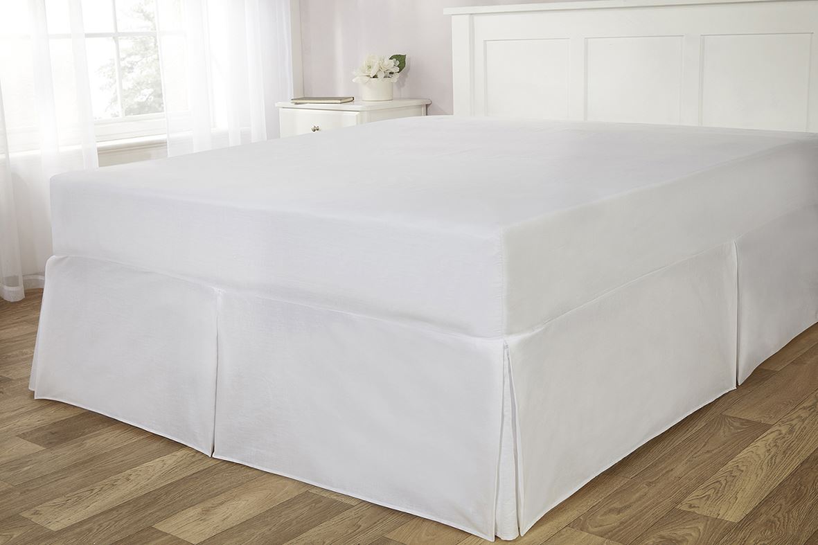 Full-length image of the cream Easy Fit Valance Sheet fitted neatly over a double-sized bed showcasing its elegant and cosy appearance